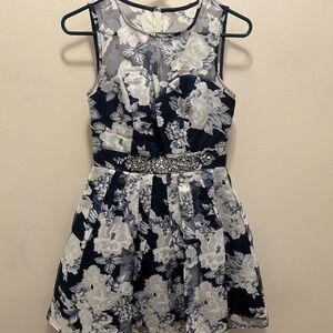 Semi formal dress with embellished waistline and illusion neck.